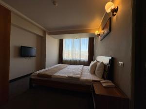 Postel nebo postele na pokoji v ubytování Nairi Hotel Yerevan