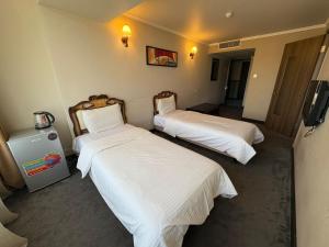 Postel nebo postele na pokoji v ubytování Nairi Hotel Yerevan