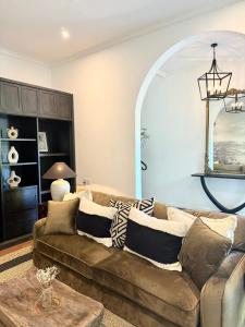 a living room with a couch and a table at Saige House - Room in Shared Villa in Canggu