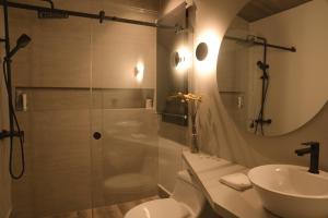 a bathroom with a shower and a toilet and a sink at Las Cabañas by PMJ in Cayambe +70 photos