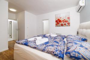 Postel nebo postele na pokoji v ubytování Villa Ceca