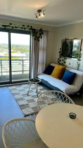 a living room with a couch and a table at The Paragon in Vosburg