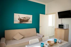 a living room with a couch and a table at Residence Valeria in Cervia