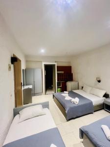 Posteľ alebo postele v izbe v ubytovaní Mark Hotel
