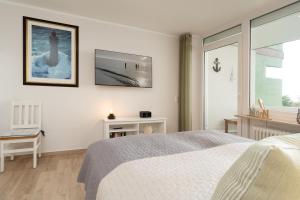 Postel nebo postele na pokoji v ubytování Driftberg 1 Wohnung 121