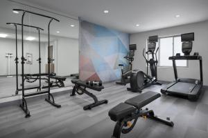 a gym with several tread machines in a room at Candlewood Suites Annapolis by IHG in Annapolis