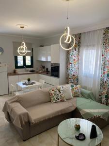 a living room with a couch and a table at Gianna's house in Nikiti