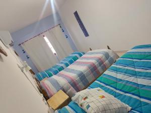 Postel nebo postele na pokoji v ubytování La Candelaria + 3 fotografie