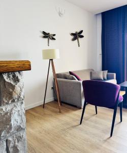 a living room with a couch and a table at Apartments Lungo Mare in Sveti Stefan