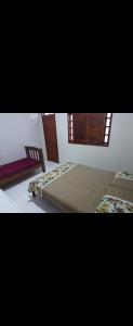 a bedroom with two beds and a window at RR Deck Betolandia in Juazeiro do Norte