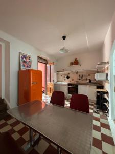 a kitchen with a table and chairs in a room at L 'appart - Aubenas in Aubenas +40 photos