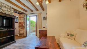 a living room with a couch and a coffee table at Olimpia 3 in Novigrad Istria