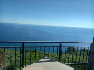 a view of the ocean from a balcony at Rezevici Sea View in Krstac