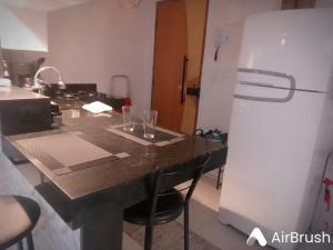 Una cocina o zona de cocina en Estilo e Conforto da Lapa