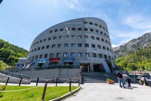 a building with people standing in front of it at Sogno di Montagna sulle piste da Sci in Bardonecchia