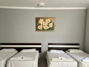 Postel nebo postele na pokoji v ubytování Oasis Praia Hotel