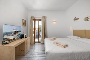 Letto o letti in una camera di The Square Rooms and Suites