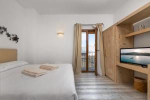 Postel nebo postele na pokoji v ubytování The Square Rooms and Suites