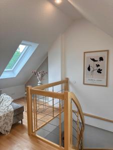 a staircase in a house with a window at HYGGE HOMES - Apartment 'Urban Nest' - Schlossnähe trifft Design in Celle