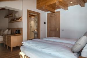 Postel nebo postele na pokoji v ubytování Chalet Cima Uomo