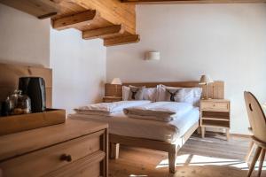 Postel nebo postele na pokoji v ubytování Chalet Cima Uomo