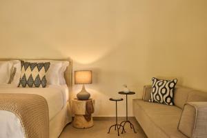 A bed or beds in a room at Nikki Beach Resort & Spa Porto Heli