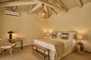 A bed or beds in a room at Nikki Beach Resort & Spa Porto Heli