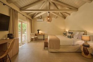 A television and/or entertainment centre at Nikki Beach Resort & Spa Porto Heli