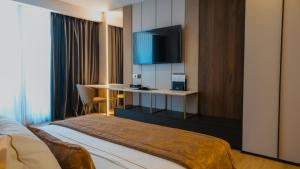 Postel nebo postele na pokoji v ubytování Grand VM Conference & SPA + 25 fotografií