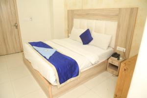 Postel nebo postele na pokoji v ubytování Hotel Aman Inn
