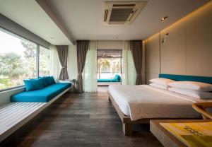Ein Bett oder Betten in einem Zimmer der Unterkunft Bann Pantai Resort