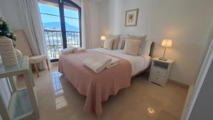 Katil atau katil-katil dalam bilik di Casa La Terrazza Los Arqueros