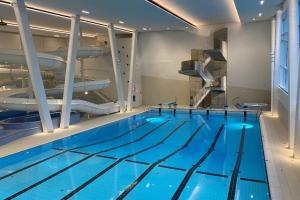 a large swimming pool with a swimming pool at Attractive and central apartment in Ålesund
