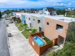 an aerial view of a house with a swimming pool at Belle Jung Villa Onna in Onna
