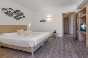 Letto o letti in una camera di The Square Rooms and Suites
