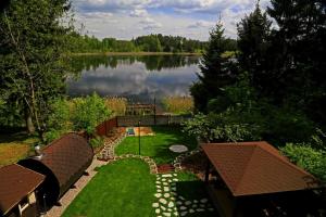 an aerial view of a lake and a backyard at Augustów Willa Sóweczka in Sucha Rzeczka