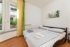 Postel nebo postele na pokoji v ubytování Elida