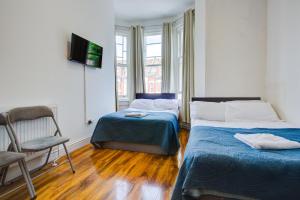 Postel nebo postele na pokoji v ubytování Harriet Gardden Hotel
