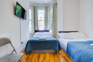 Postel nebo postele na pokoji v ubytování Harriet Gardden Hotel