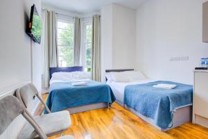 Postel nebo postele na pokoji v ubytování Harriet Gardden Hotel