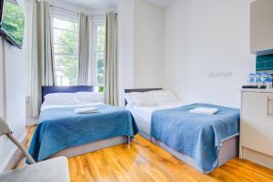 Postel nebo postele na pokoji v ubytování Harriet Gardden Hotel