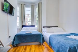 Postel nebo postele na pokoji v ubytování Harriet Gardden Hotel