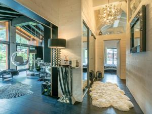 a living room with a chandelier and a rug at Prestige et luxe au cœur de Val-d'Isère, proche des pistes - FR-1-694-323 in Val dʼIsère