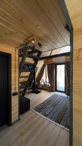 a room with a staircase in a house with a rug at Dali Space in Kolentsy +38 photos