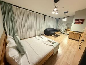 a bedroom with a bed and a chair in a room at Taksim alkan tower residence in Istanbul