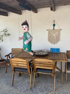 a statue of a nutcracker sitting on a table at Eros Beach Hotel in Benitses