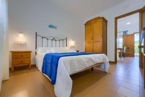 Postel nebo postele na pokoji v ubytování Hostal del Faro