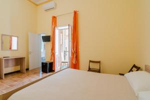 Postel nebo postele na pokoji v ubytování Camera in Dimora La Torre - Salento Selection + 5 fotografií