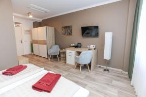 Postel nebo postele na pokoji v ubytování Second Home Hotel