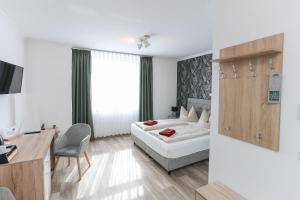 Postel nebo postele na pokoji v ubytování Second Home Hotel